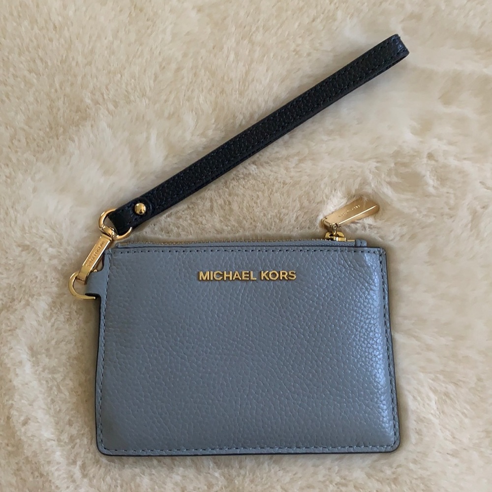 A beautiful Michael Kors wristlet, brand new